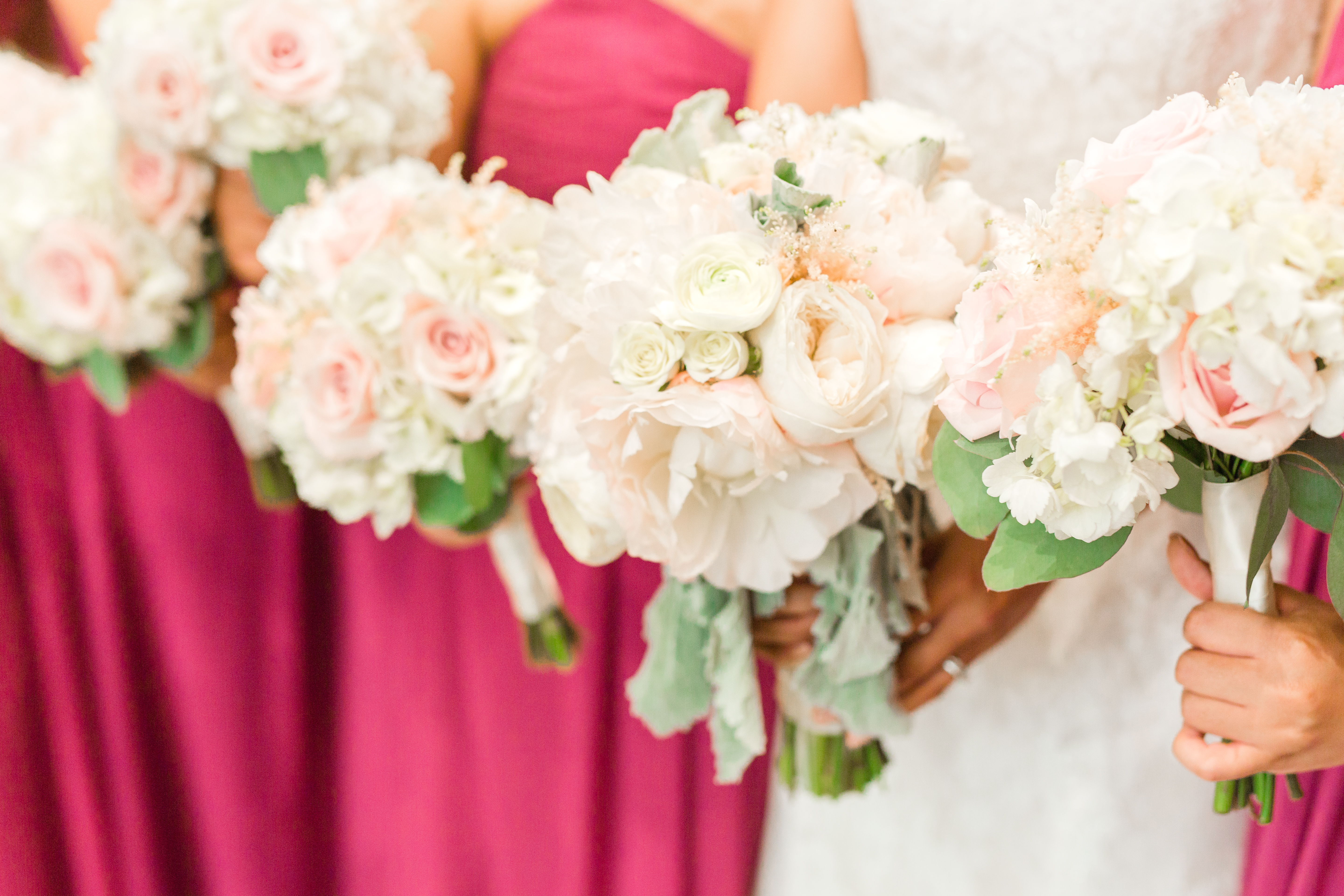 Bridesmaid and bridal flowers and bouquets of whites and pink peonies