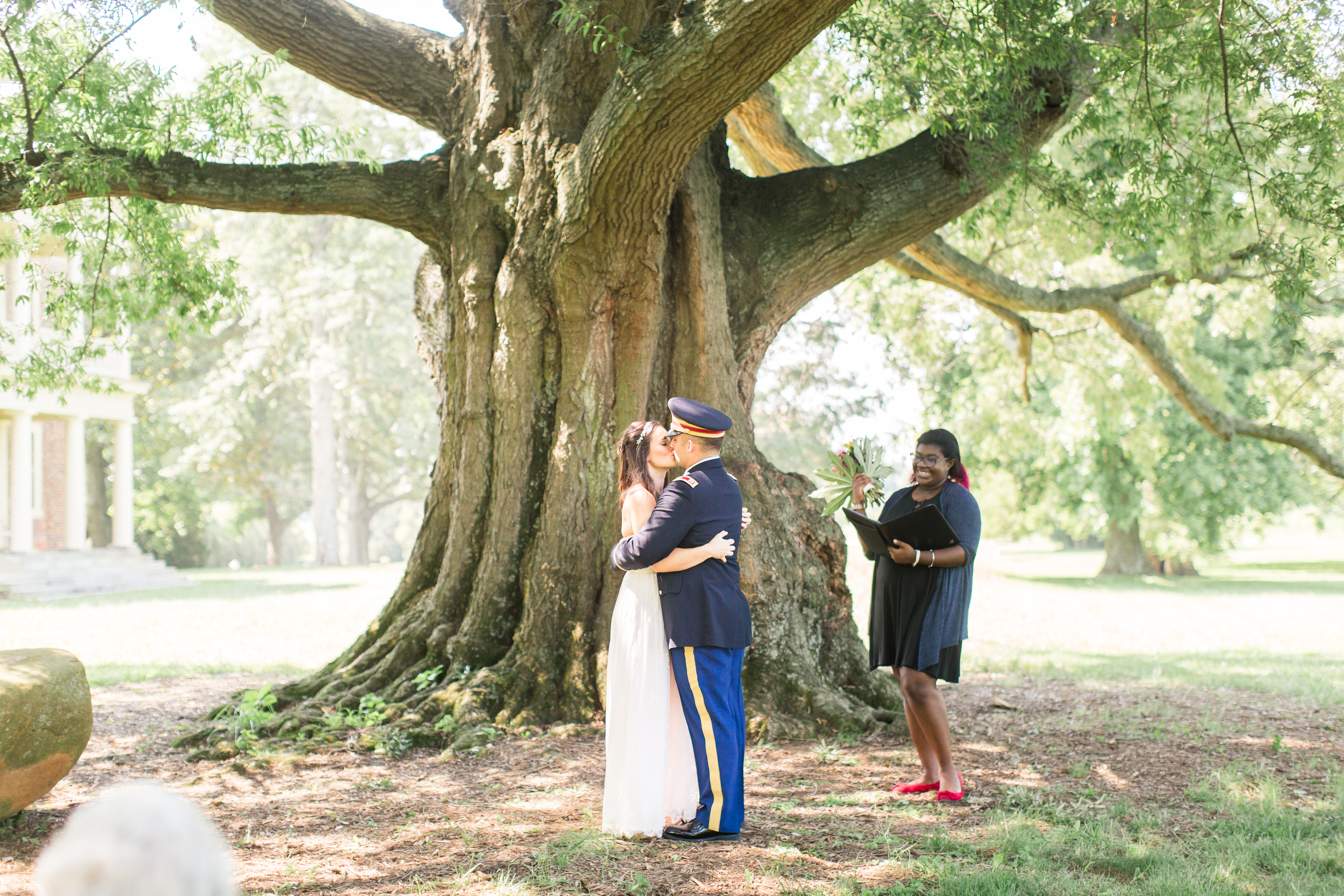 bride and groom married under a big tree at shirley plantation