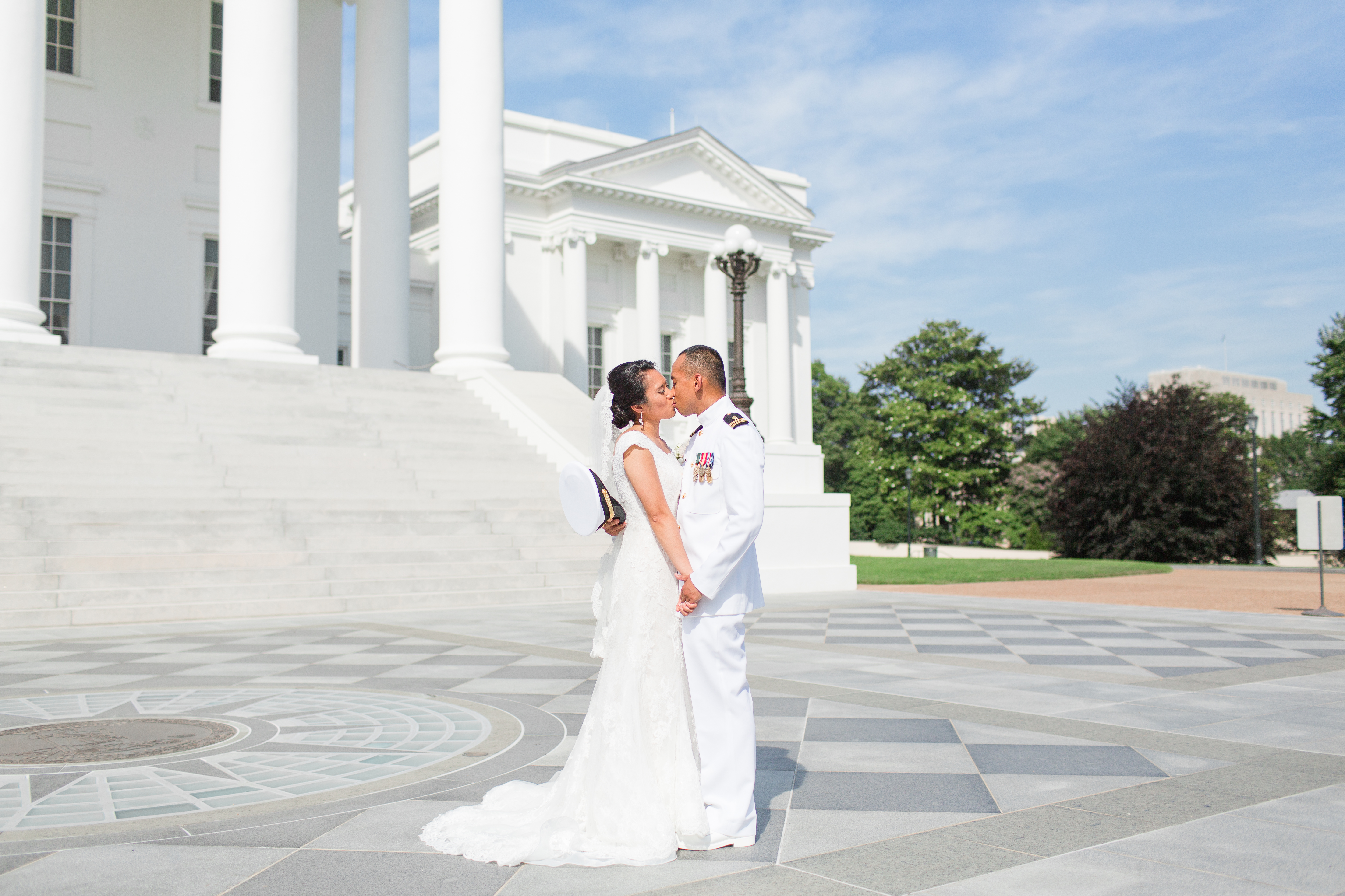 bride and groom kissing at the virginia state capital